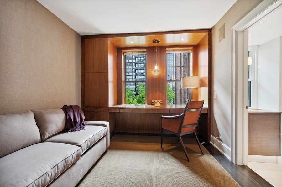 20 East Cedar Street, Unit 4D Chicago, IL 60611 - Photo 23 of 29 a living room with furniture and a window