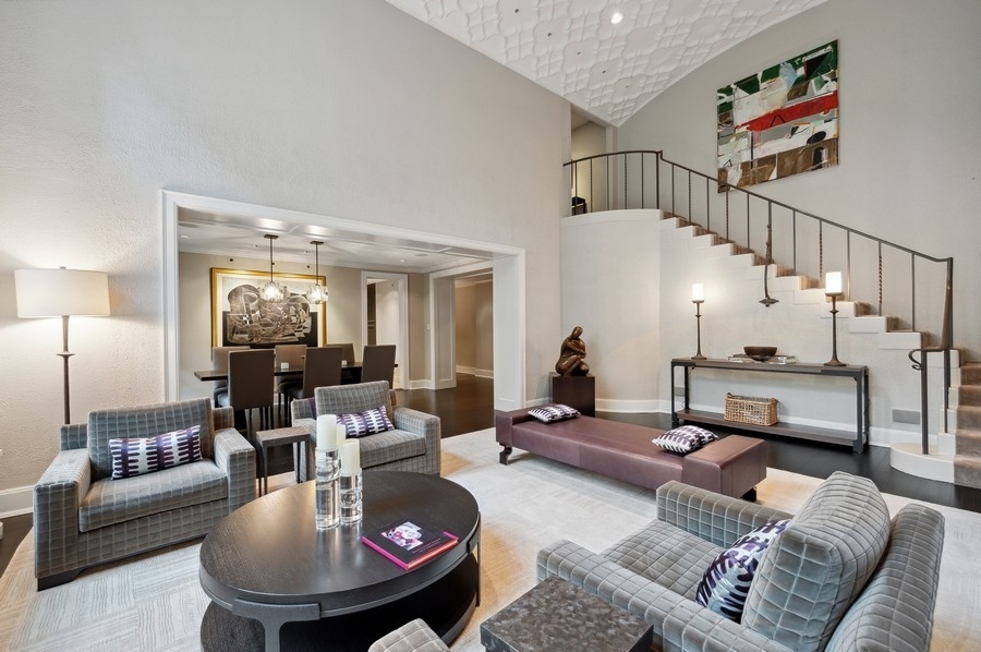 20 East Cedar Street, Unit 4D Chicago, IL 60611 - Photo 8 of 29 a living room with furniture and a chandelier