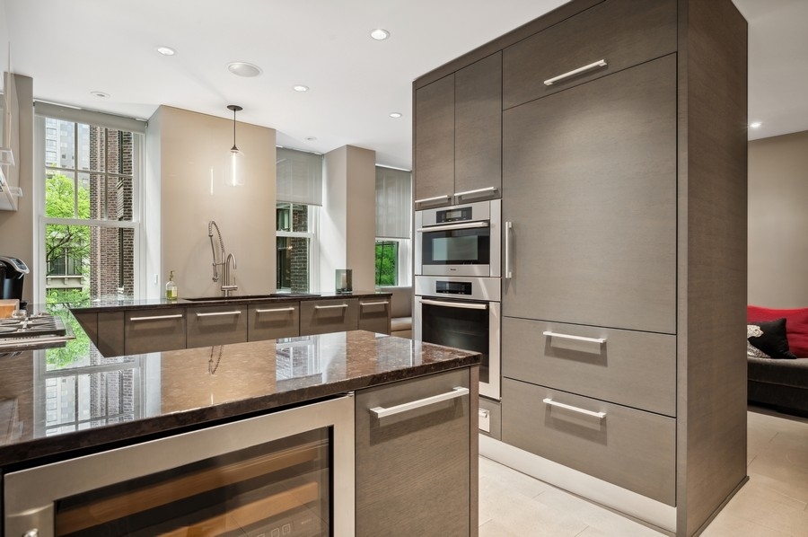 20 East Cedar Street, Unit 4D Chicago, IL 60611 - Photo 10 of 29 a kitchen with stainless steel appliances a refrigerator and a stove