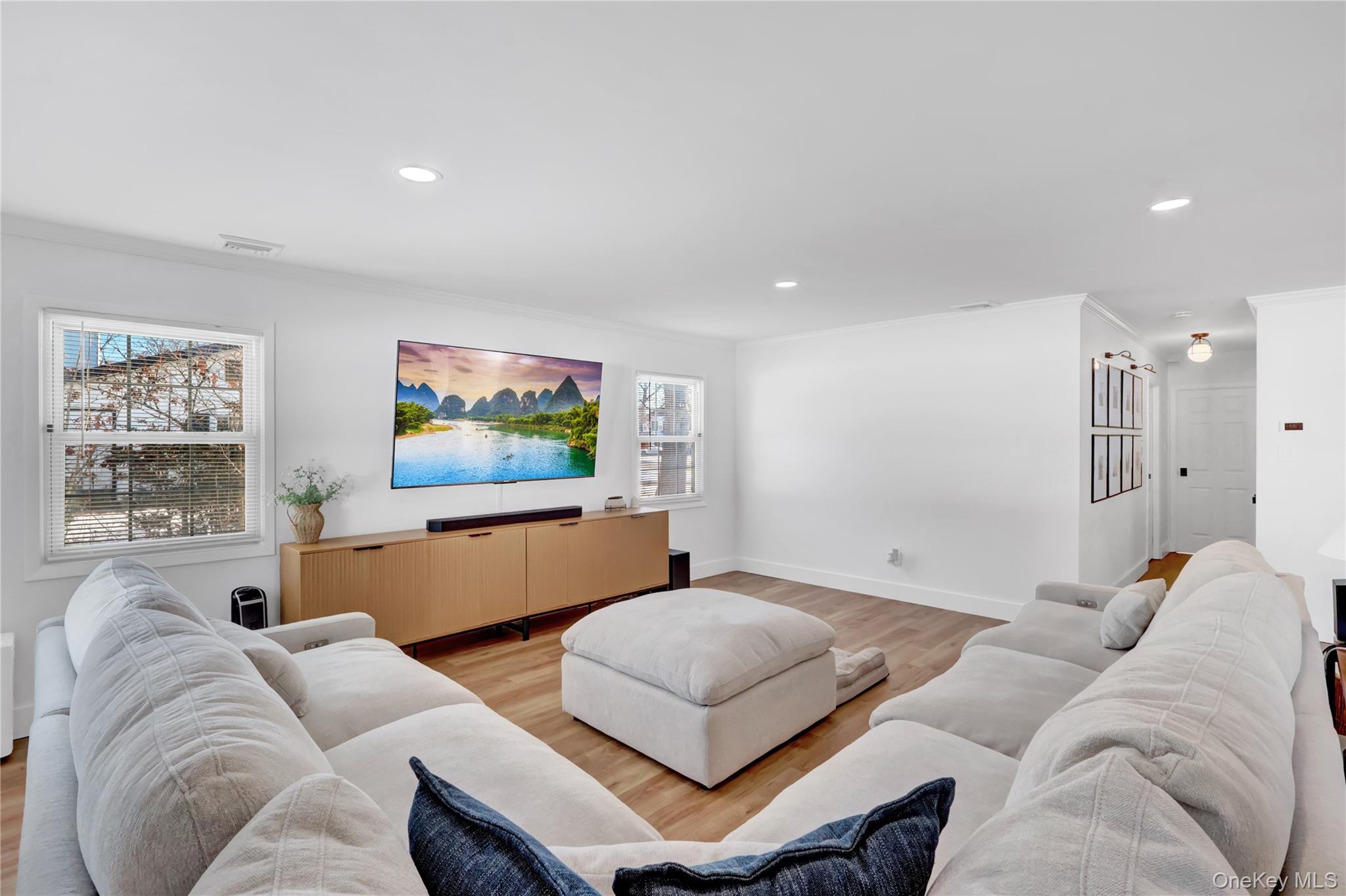 15 Whitmore Lane Coram, NY 11727 - Photo 2 of 10 a living room with furniture and a flat screen tv