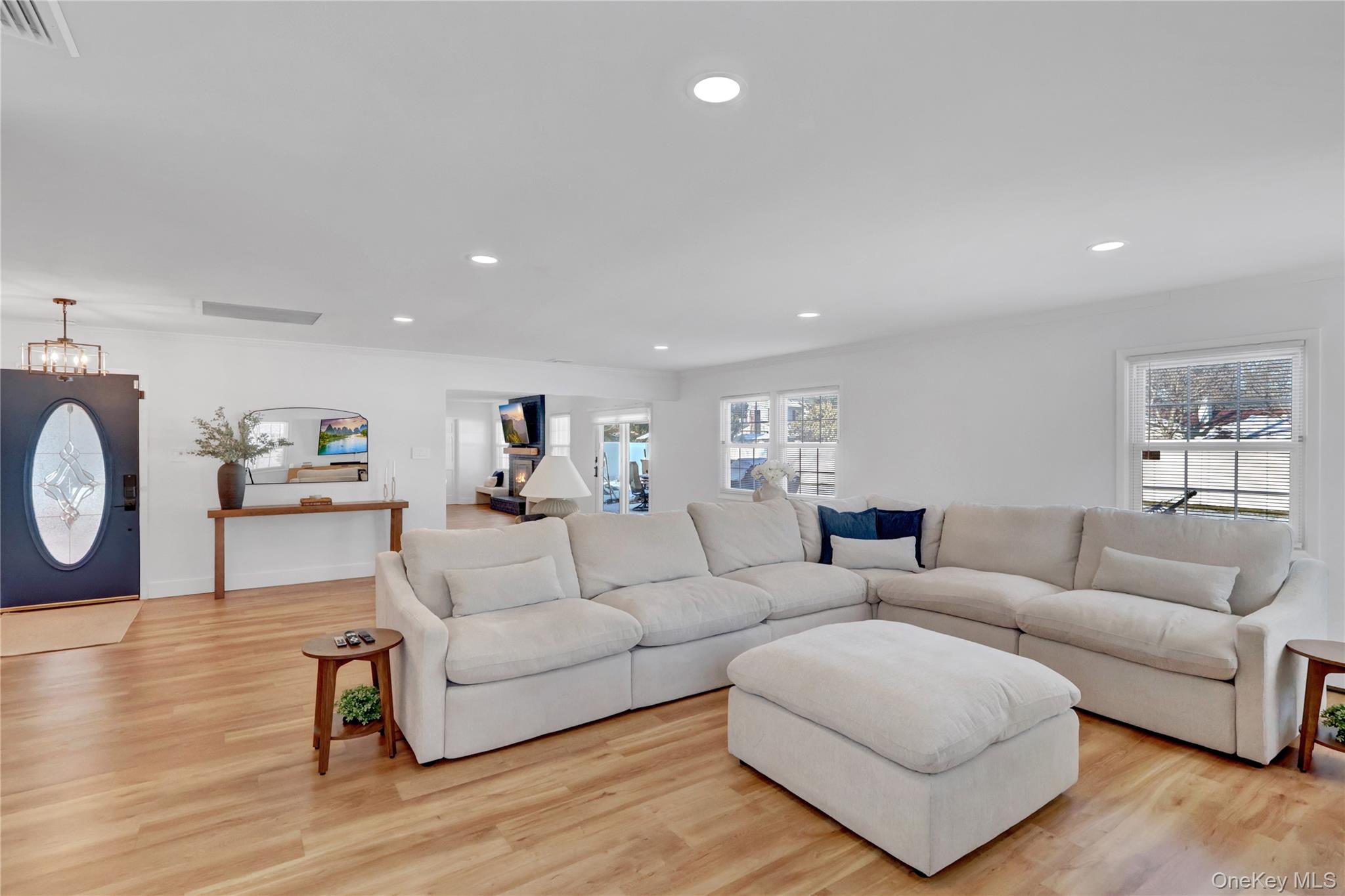 15 Whitmore Lane Coram, NY 11727 - Photo 3 of 10 a living room with furniture and a wooden floor