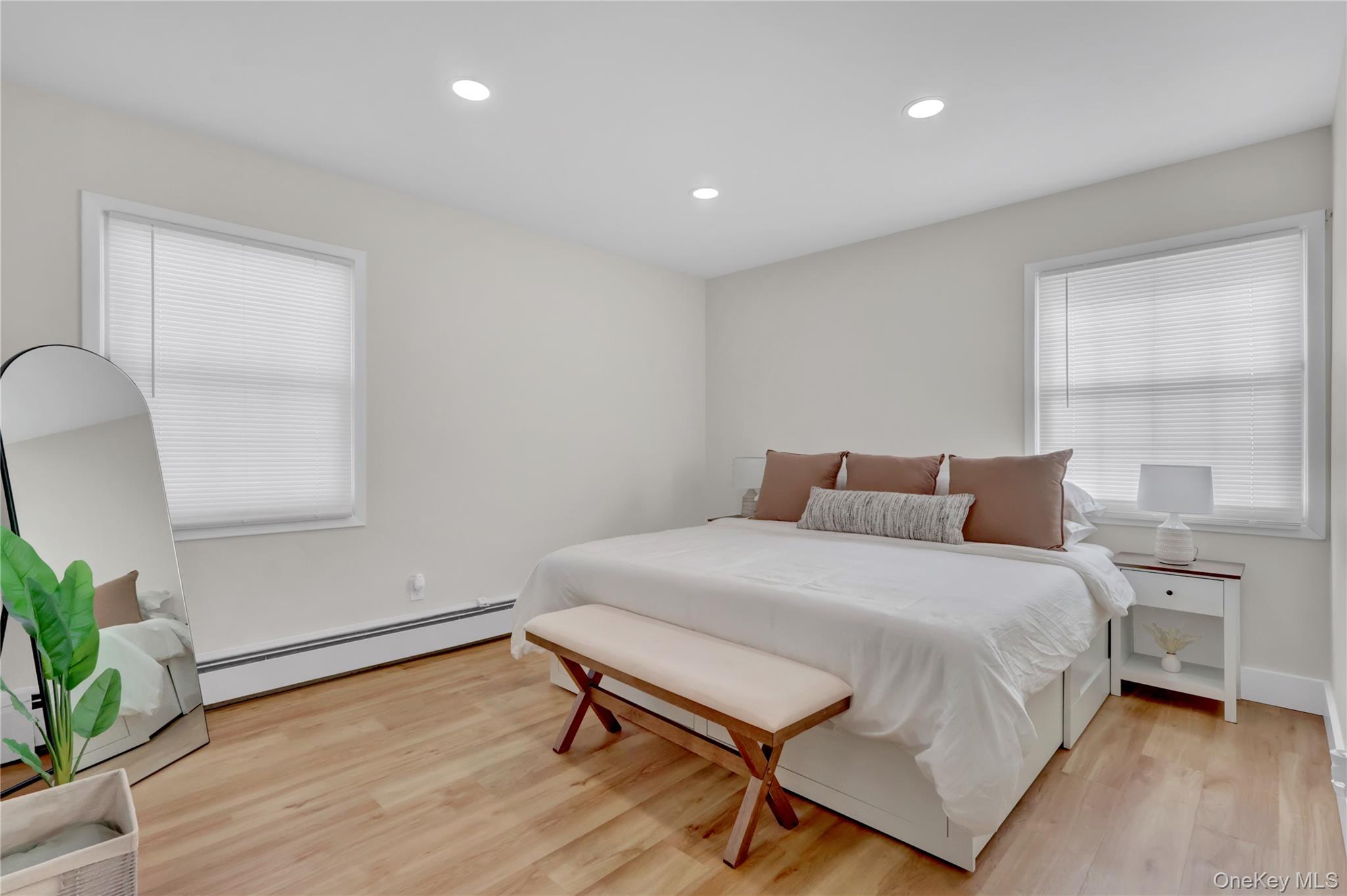 15 Whitmore Lane Coram, NY 11727 - Photo 8 of 10 a bedroom with a bed and a window