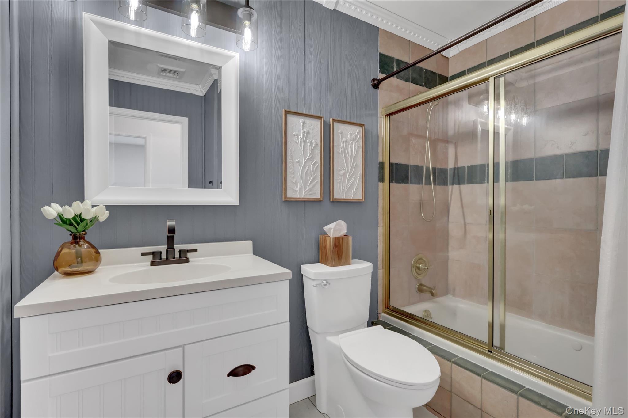 15 Whitmore Lane Coram, NY 11727 - Photo 9 of 10 a bathroom with a sink toilet and shower