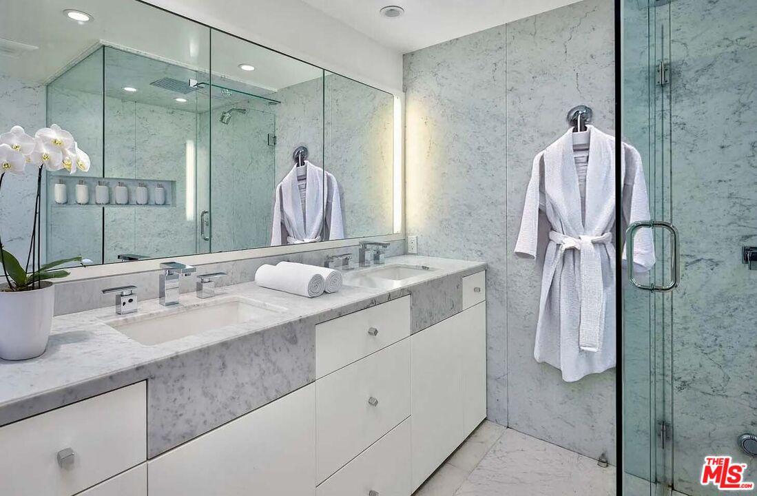 1000 Stradella Road Los Angeles, CA 90077 - Photo 12 of 29 a bathroom with a double vanity sink mirror and shower