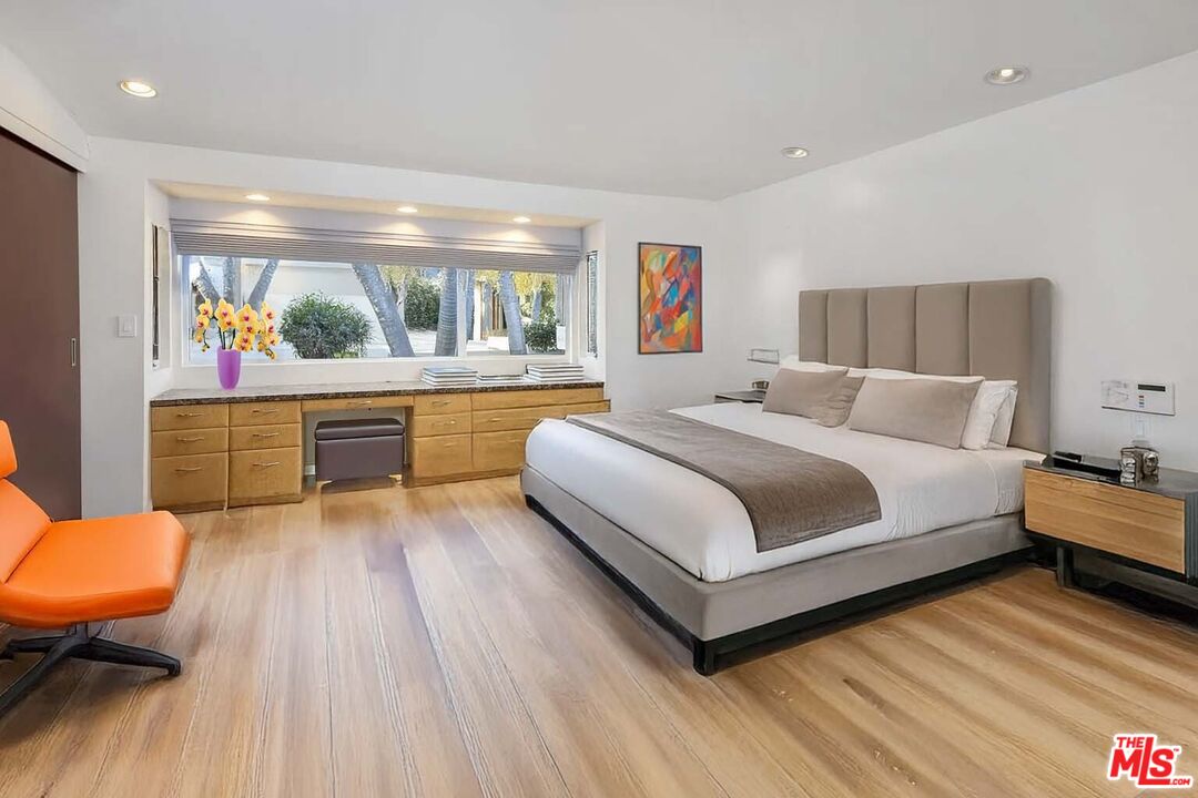 1000 Stradella Road Los Angeles, CA 90077 - Photo 14 of 29 a bedroom with furniture and a large window