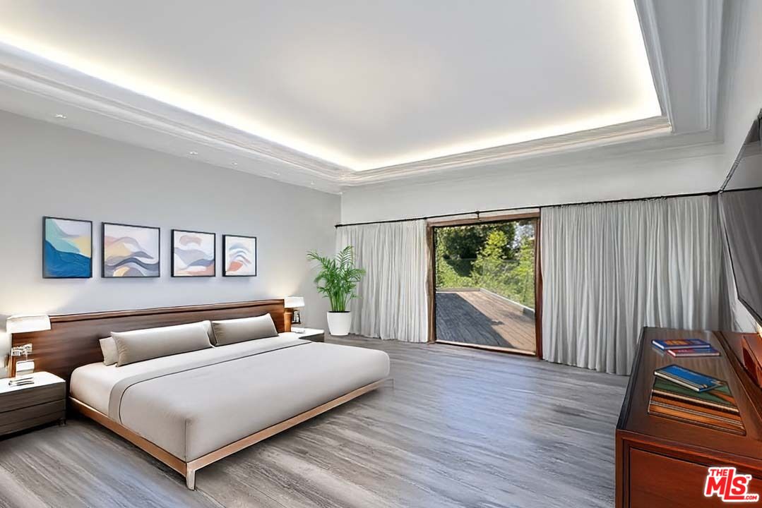 1000 Stradella Road Los Angeles, CA 90077 - Photo 23 of 29 a bedroom with a bed and a large window