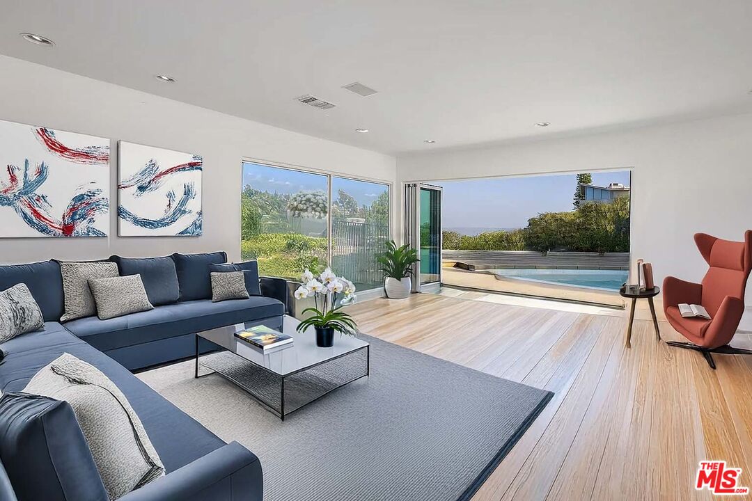 1000 Stradella Road Los Angeles, CA 90077 - Photo 3 of 29 a living room with furniture and a large window