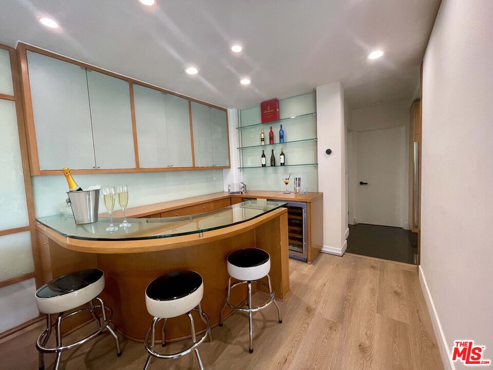 1000 Stradella Road Los Angeles, CA 90077 - Photo 5 of 29 a kitchen with a table and chairs