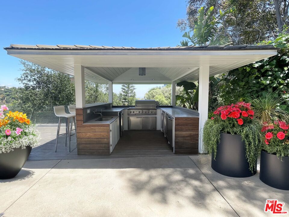1000 Stradella Road Los Angeles, CA 90077 - Photo 7 of 29 a view of a patio with chairs and potted plants