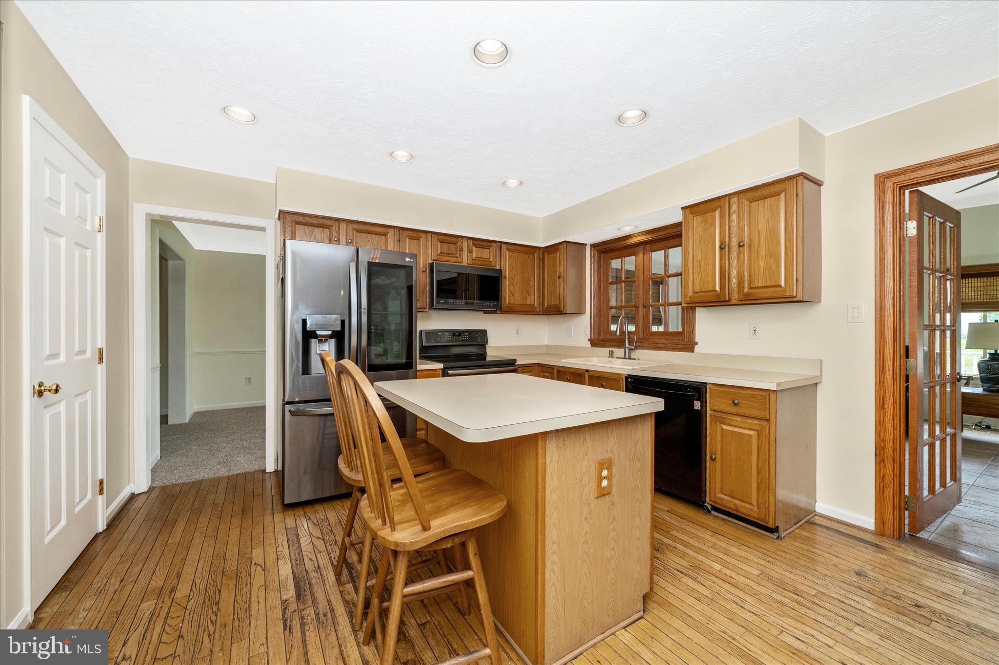 9534 Liberty Road Frederick, MD 21701 - Photo 16 of 70 a kitchen with a sink a counter top space stainless steel appliances and cabinets