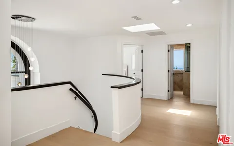 a view of a hallway with staircase