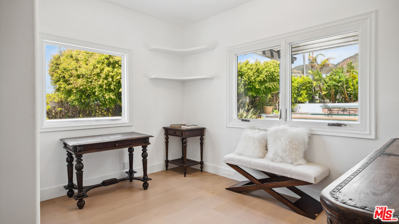29675 Harvester Road Malibu, CA 90265 - Photo 21 of 36 a living room with furniture and a window