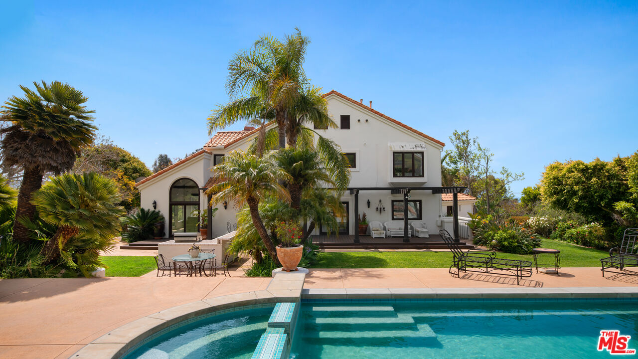 29675 Harvester Road Malibu, CA 90265 - Photo 30 of 36 a view of a house with a swimming pool