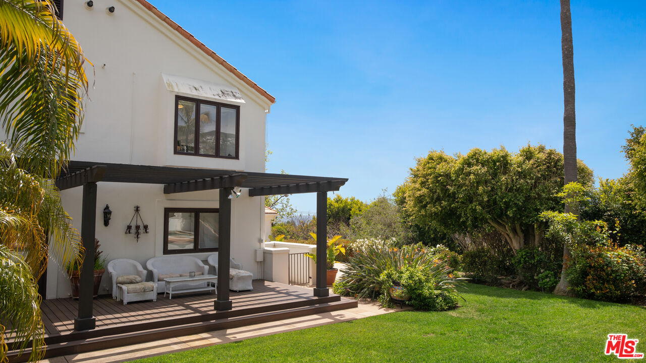 29675 Harvester Road Malibu, CA 90265 - Photo 32 of 36 a front view of a house with garden