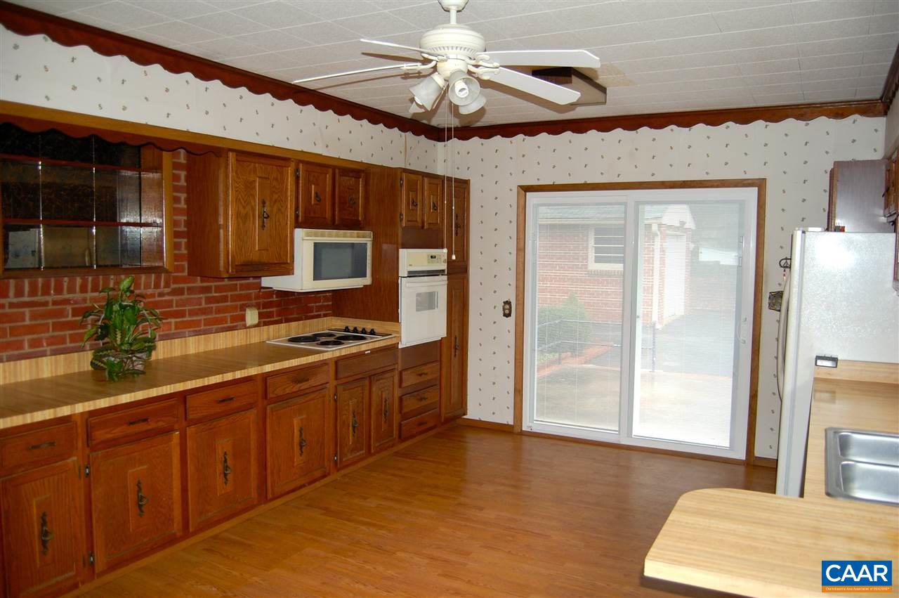 100 Apple Tree Road Charlottesville, VA 22903 - Photo 16 of 22 a kitchen with stainless steel appliances granite countertop a stove a sink dishwasher and a refrigerator with wooden floor