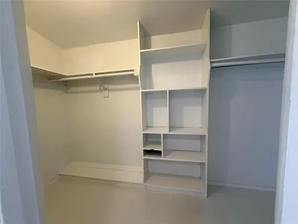 a empty closet with white paint