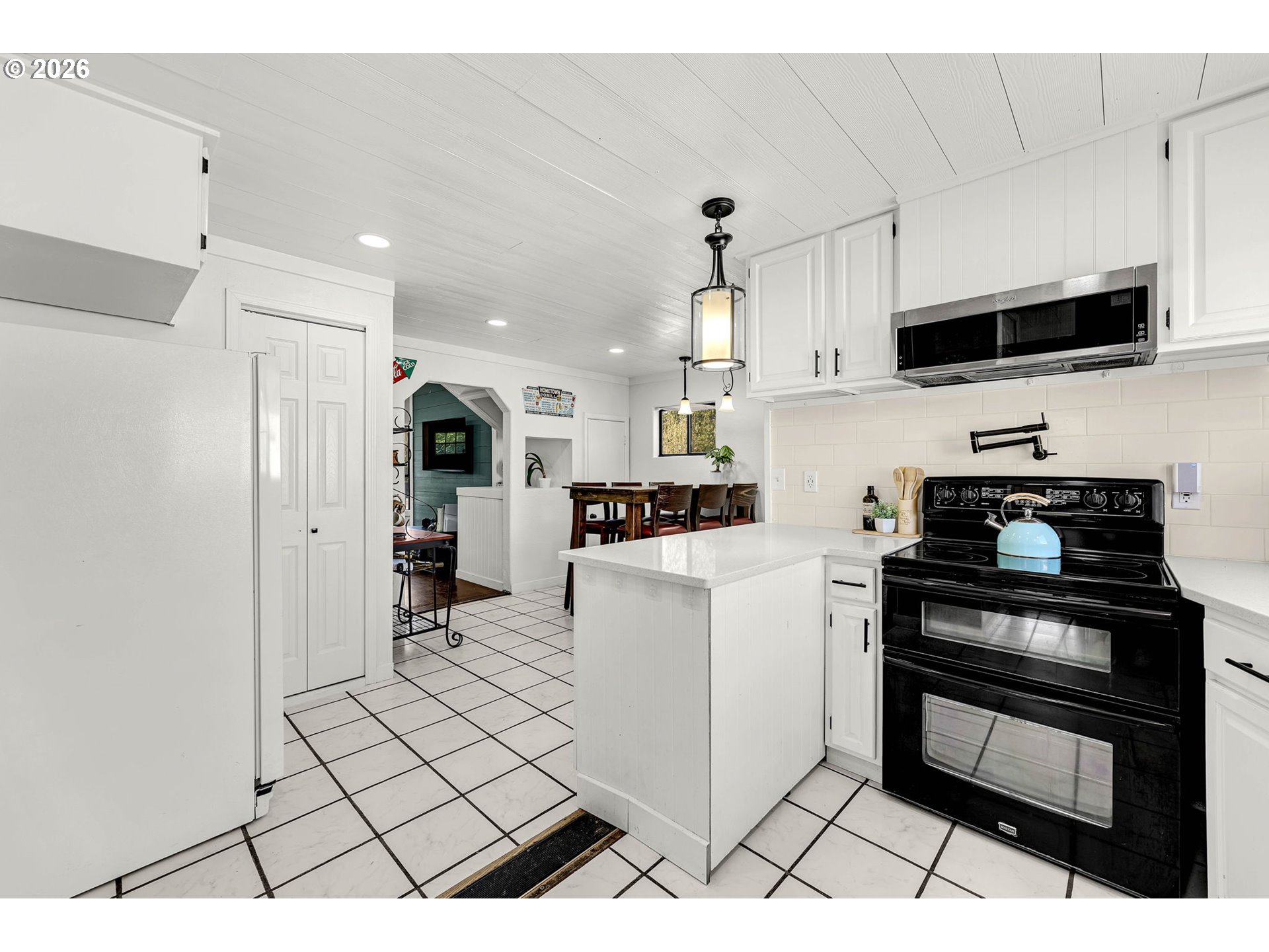 19905 Northeast 176th Avenue Battle Ground, WA 98604 - Photo 16 of 38 a kitchen with stainless steel appliances a refrigerator and a stove top oven