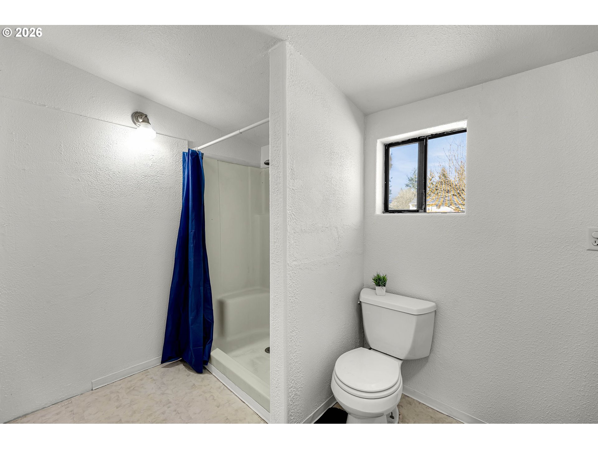 19905 Northeast 176th Avenue Battle Ground, WA 98604 - Photo 19 of 38 a bathroom with a toilet and a shower