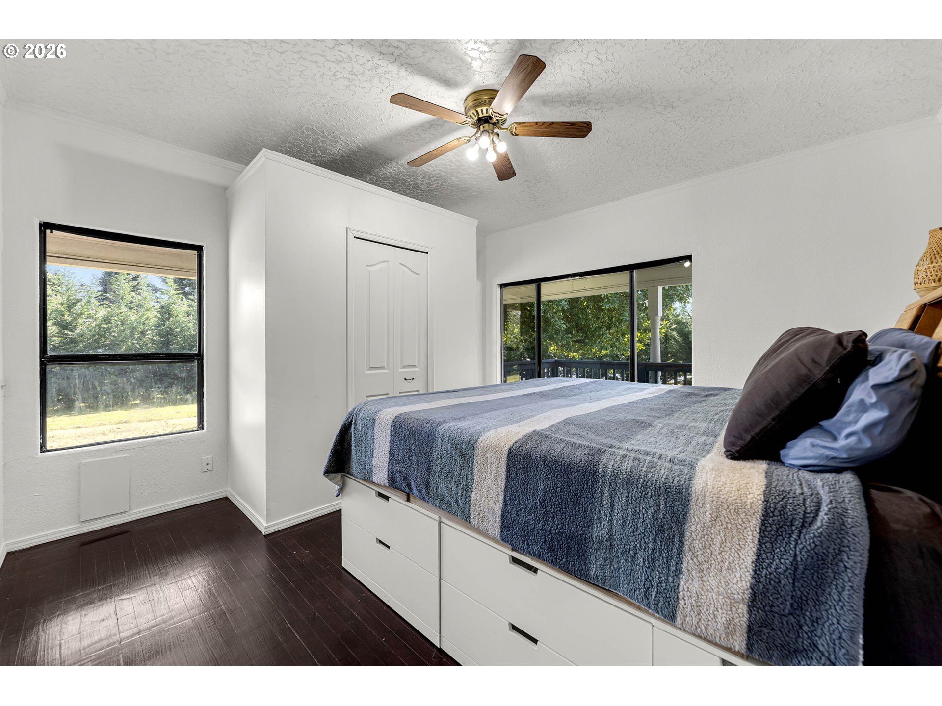 19905 Northeast 176th Avenue Battle Ground, WA 98604 - Photo 23 of 38 a bedroom with a large bed and a window