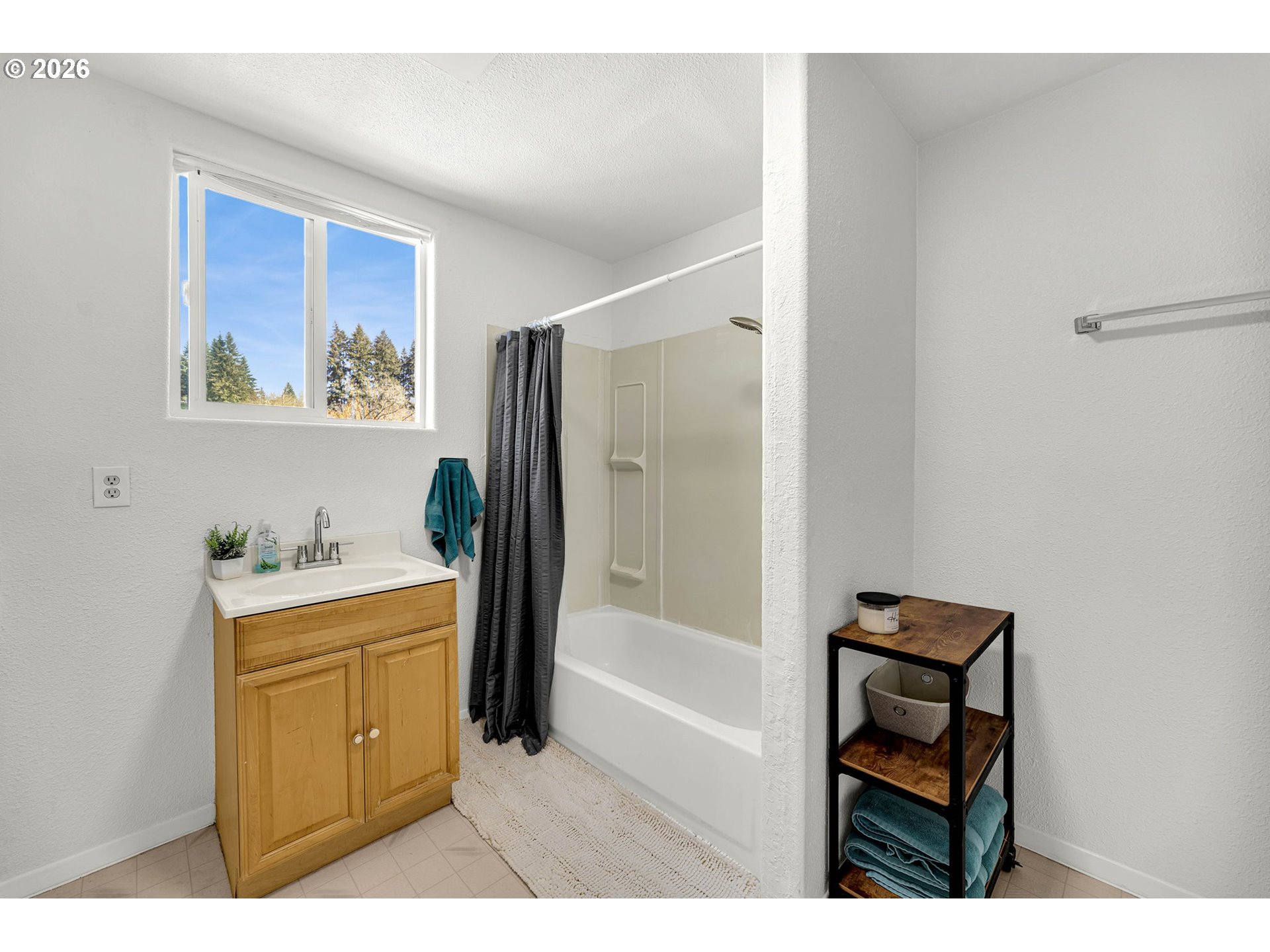 19905 Northeast 176th Avenue Battle Ground, WA 98604 - Photo 28 of 38 a bathroom with a sink a bathtub and a window