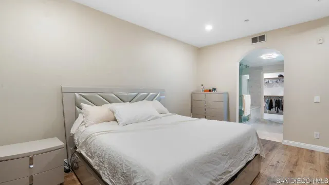 a bedroom with a bed and a view of bathroom