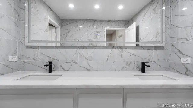 a bathroom with a sink and mirror