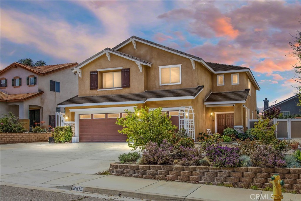 8515 McAlpine Lane Riverside, CA 92508 - Photo 1 of 1 a front view of a house with a yard and garage
