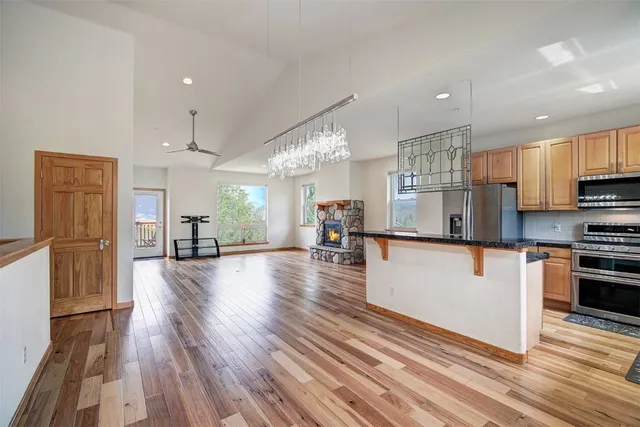 a kitchen with stainless steel appliances a refrigerator sink and cabinets