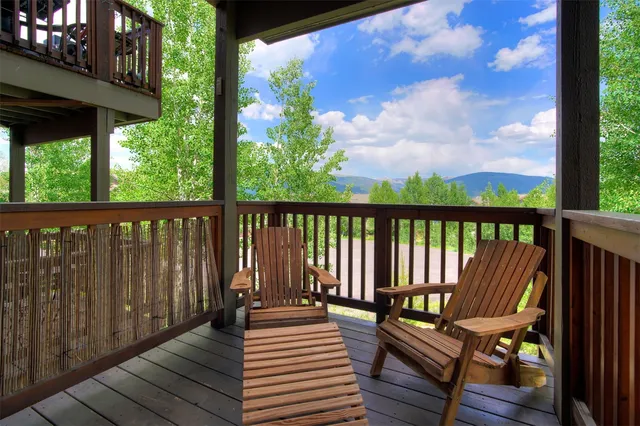 a view of a balcony with wooden floor