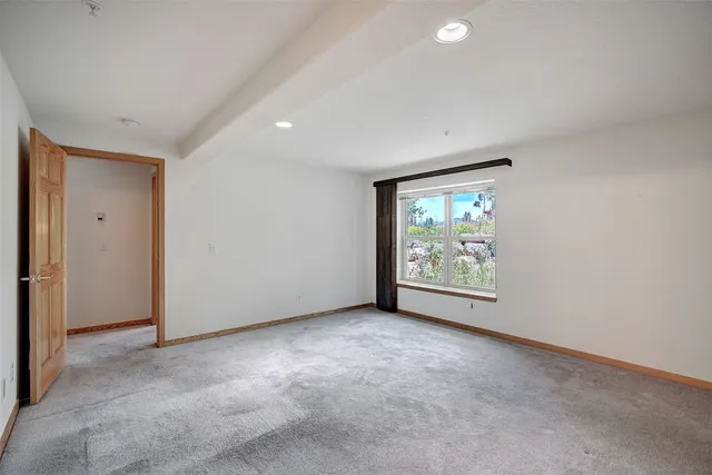 a bathroom with a bathtub a sink a mirror and a shower