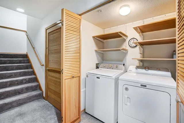 a view of a house with a yard and garden