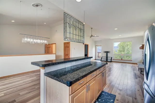 a kitchen with sink stove and cabinets