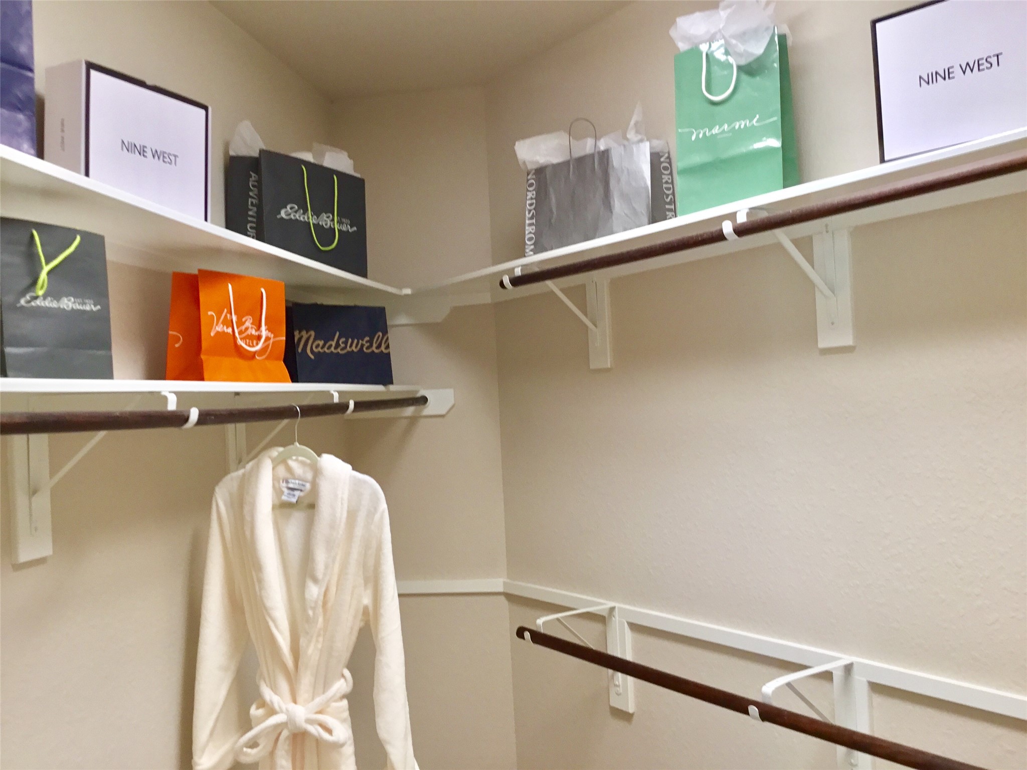 2 Islewood Boulevard Spring, TX 77380 - Photo 31 of 48 Spacious walk-in closet with multiple shelves and hanging rods, perfect for organizing clothes and accessories.