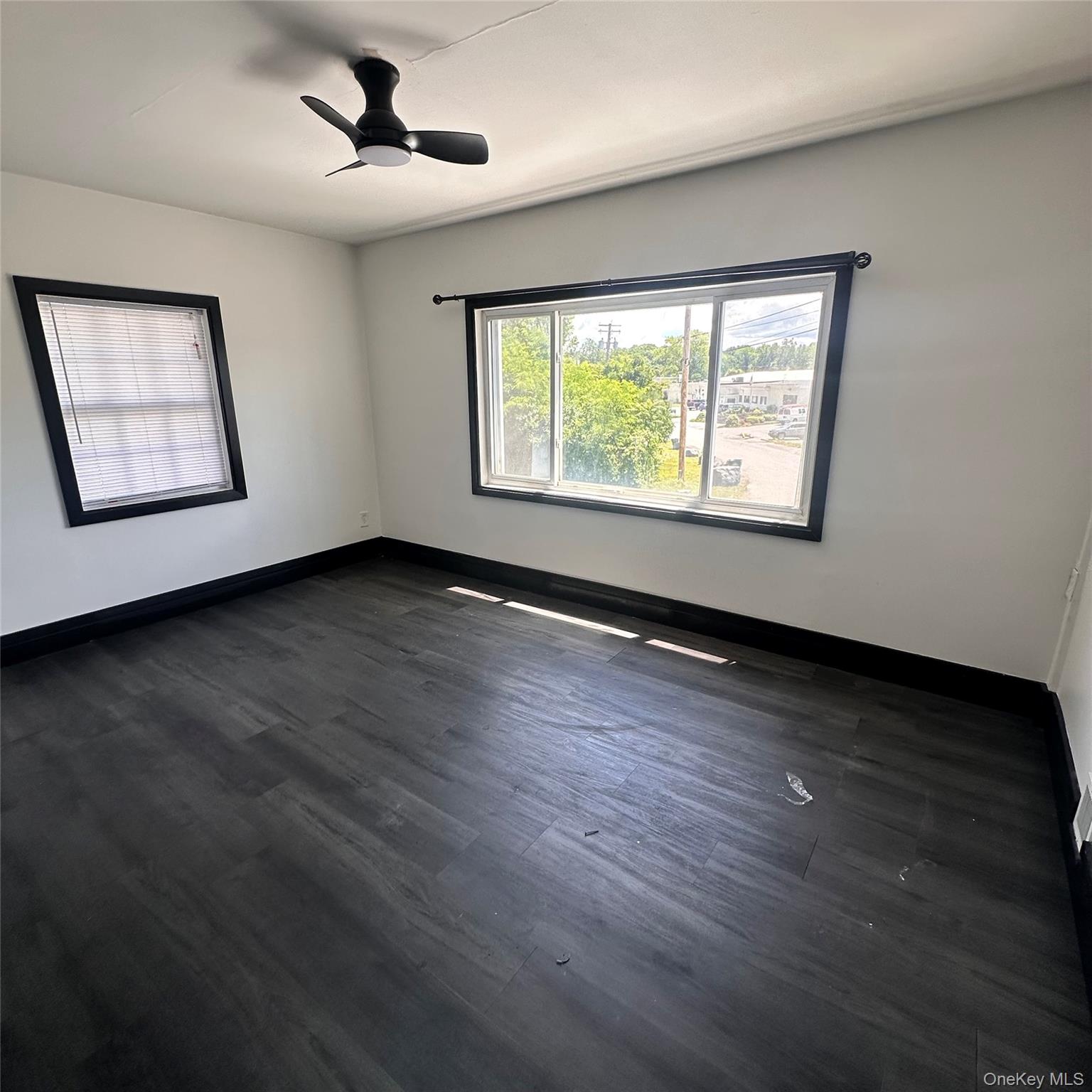152 Smith Street, Unit 2 Poughkeepsie, NY 12601 - Photo 4 of 8 Bedroom. Vinyl flooring, ceiling fan with light, forced air vent.