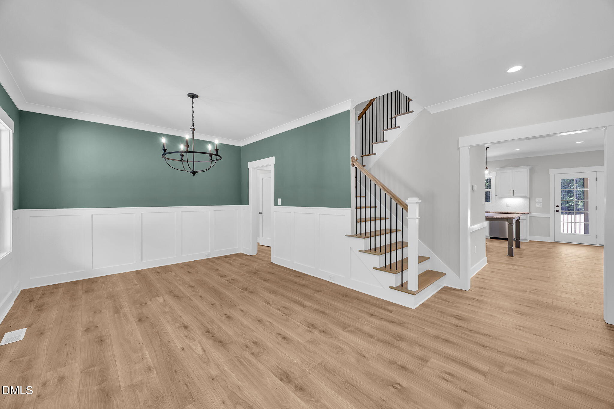 378 Freedom Ridge Drive Smithfield, NC 27577 - Photo 7 of 33 a view of a livingroom with wooden floor and stairs