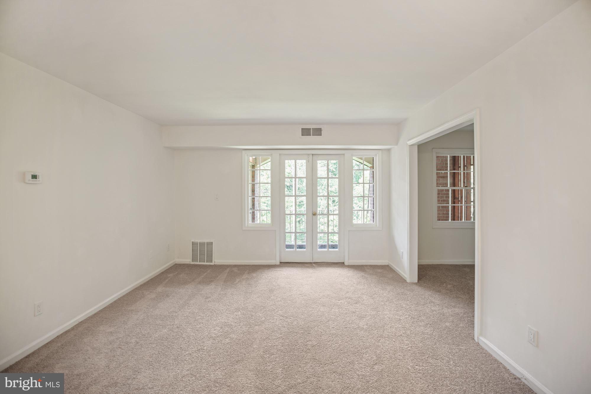 8112 Colony Point Road, Unit 231 Springfield, VA 22152 - Photo 12 of 30 View of living room and adjoining den/study