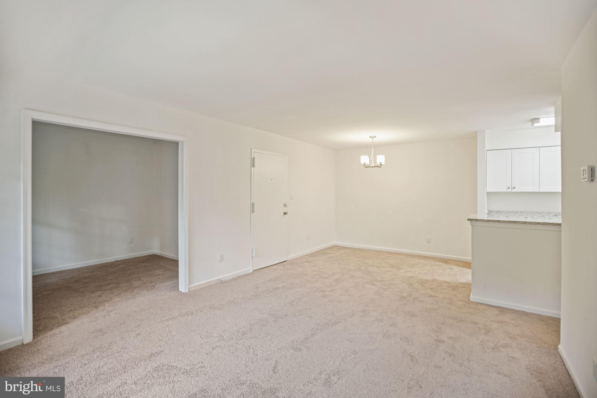 8112 Colony Point Road, Unit 231 Springfield, VA 22152 - Photo 13 of 30 Another view of dining area and den entrace