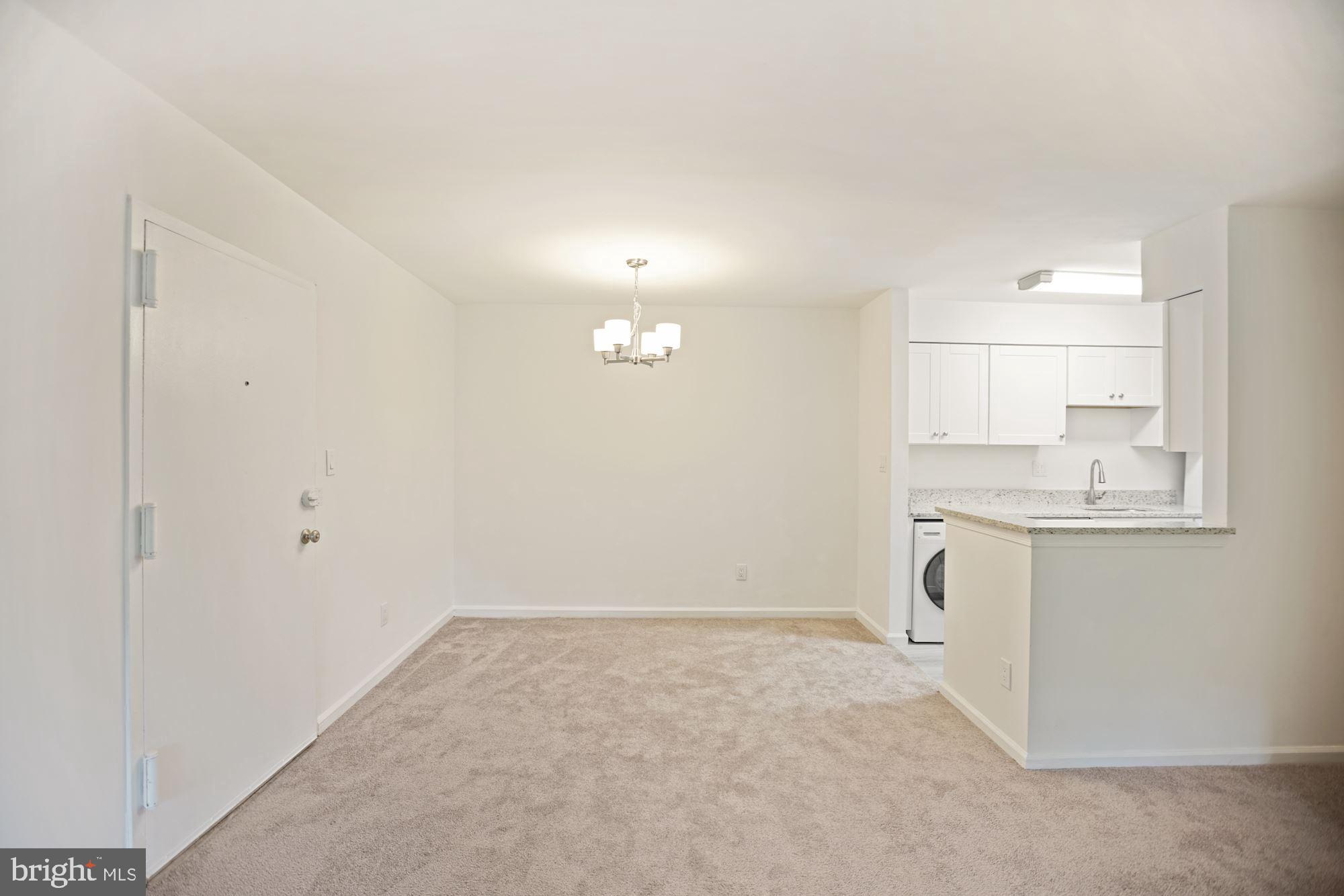 8112 Colony Point Road, Unit 231 Springfield, VA 22152 - Photo 6 of 30 Defined dining area with new fixture