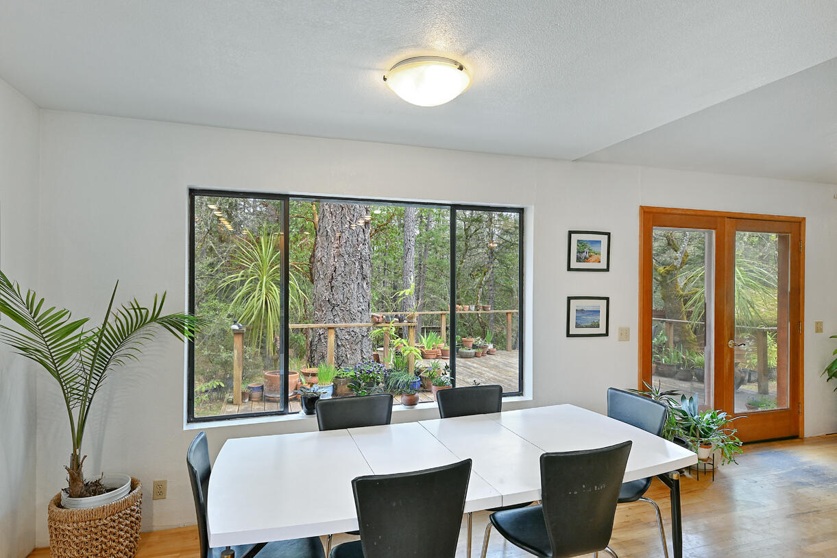9355 Lower River Road Grants Pass, OR 97526 - Photo 7 of 41 a living room with furniture and large windows