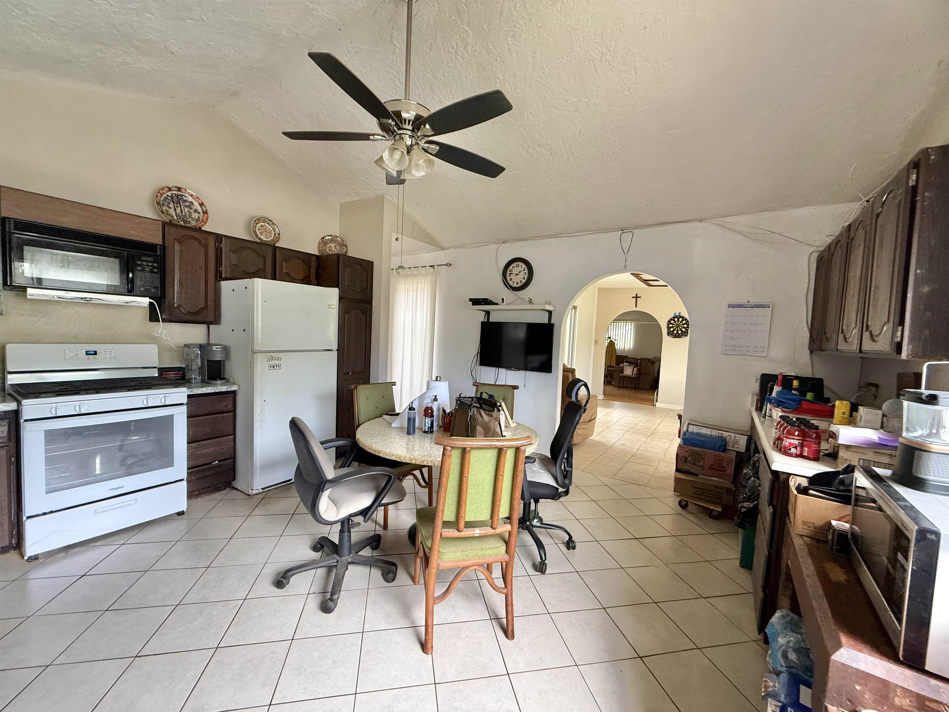 1630 Kauhikoa Road Haiku, HI 96708 - Photo 11 of 48 a living room with furniture a flat screen tv and a window