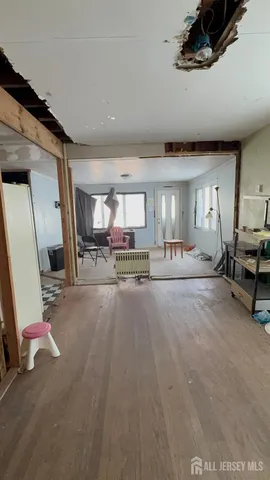 a view of a livingroom with furniture and a flat screen tv