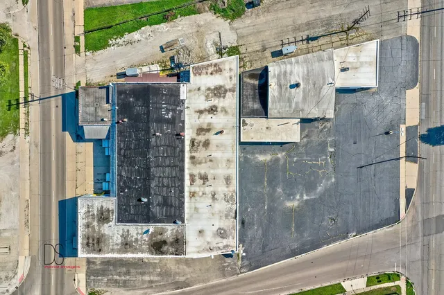 a aerial view of a brick building with large windows