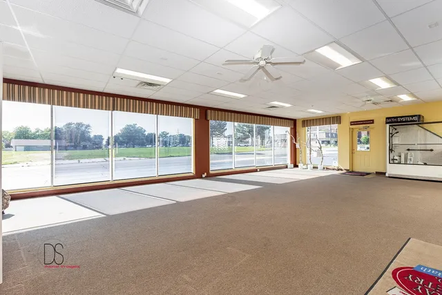 a view of an empty room with a sliding door