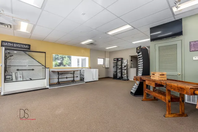 a view of a livingroom with furniture and a window
