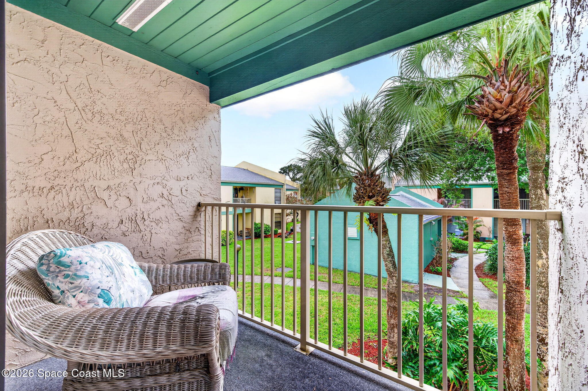 1225 North Wickham Road, Unit 422 Melbourne, FL 32935 - Photo 22 of 32 a view of a balcony with furniture