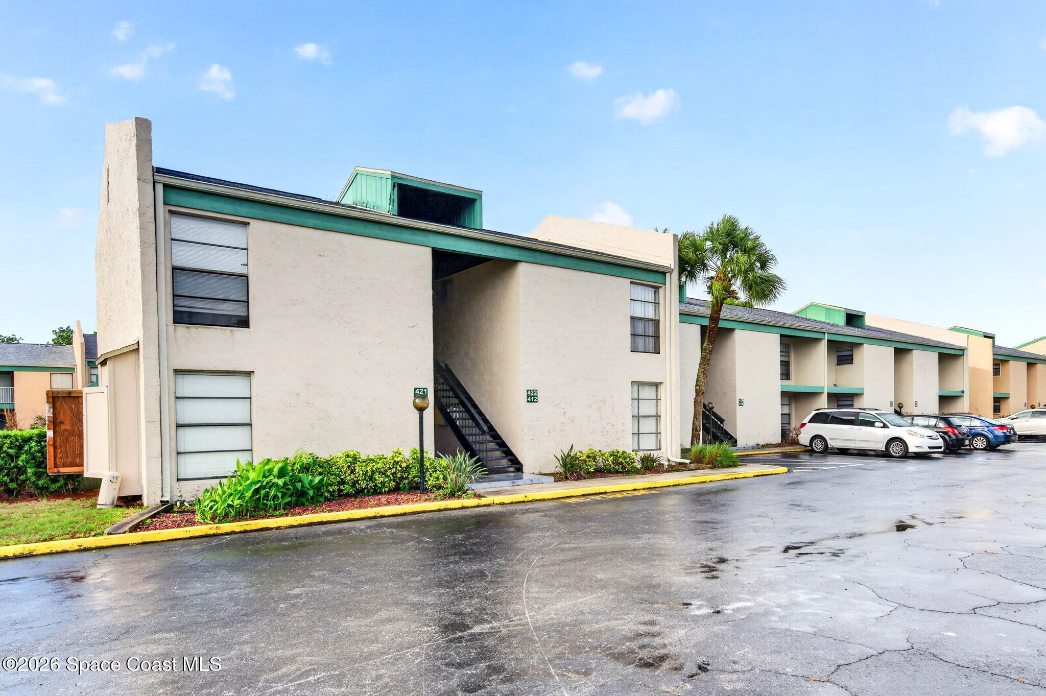 1225 North Wickham Road, Unit 422 Melbourne, FL 32935 - Photo 25 of 32 a view of a street with cars