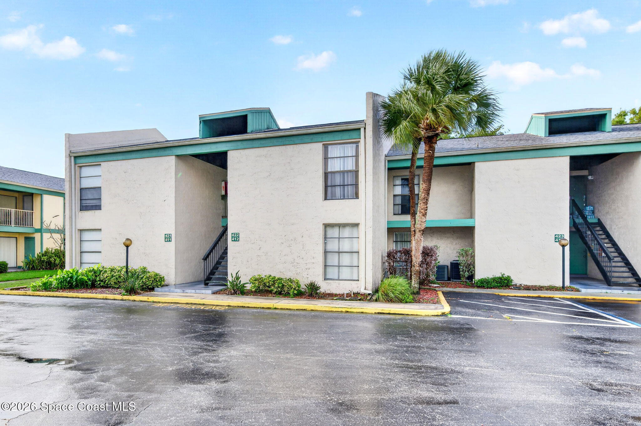 1225 North Wickham Road, Unit 422 Melbourne, FL 32935 - Photo 27 of 32 a view of outdoor space and front view of house