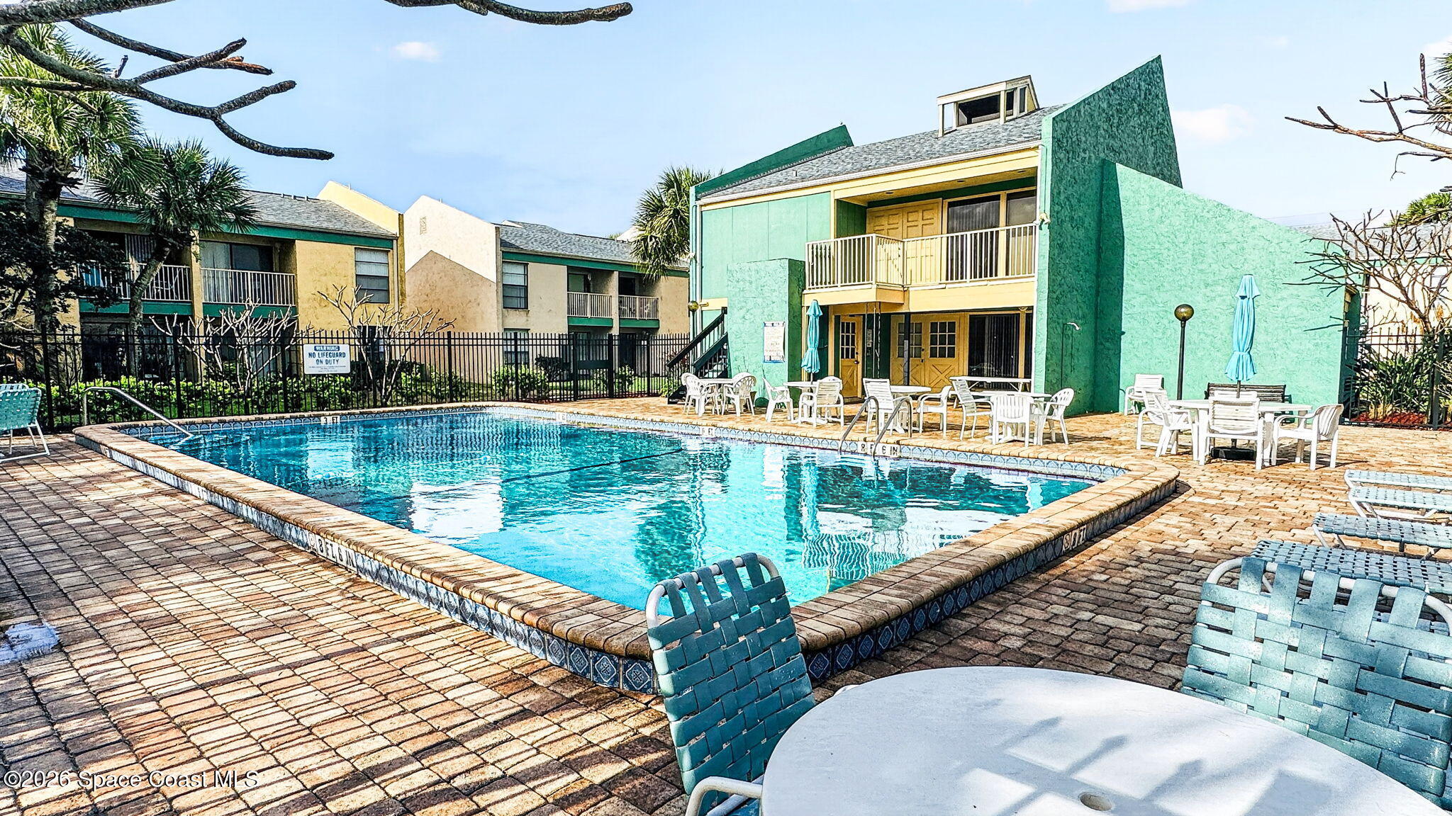 1225 North Wickham Road, Unit 422 Melbourne, FL 32935 - Photo 31 of 32 a view of a patio with swimming pool