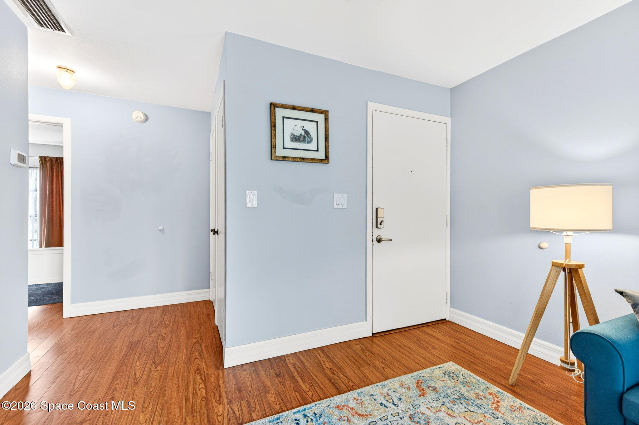 1225 North Wickham Road, Unit 422 Melbourne, FL 32935 - Photo 4 of 32 a view of room with wooden floor