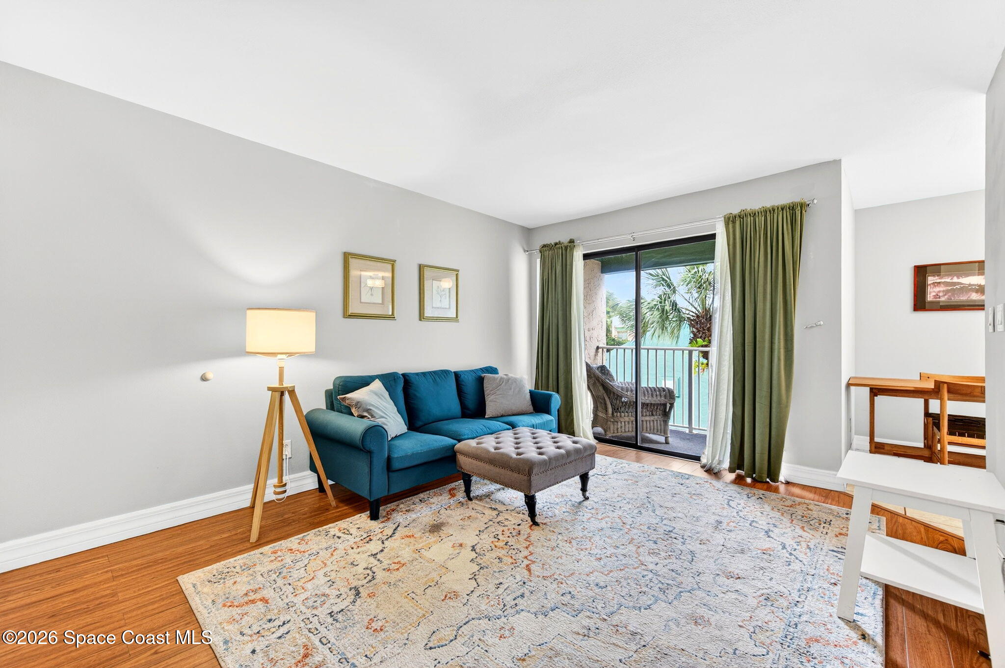 1225 North Wickham Road, Unit 422 Melbourne, FL 32935 - Photo 5 of 32 a living room with furniture and a window